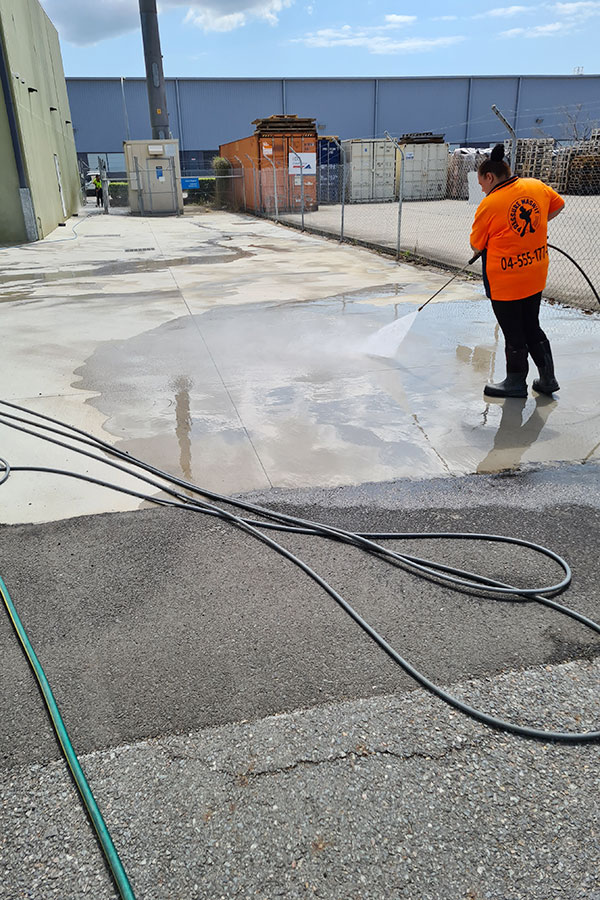 cleaning concrete on a Brisbane construction site